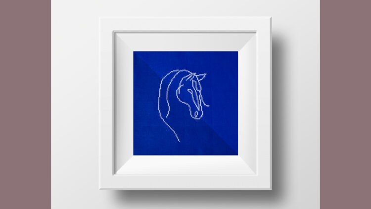 Broderet hestehoved i ramme